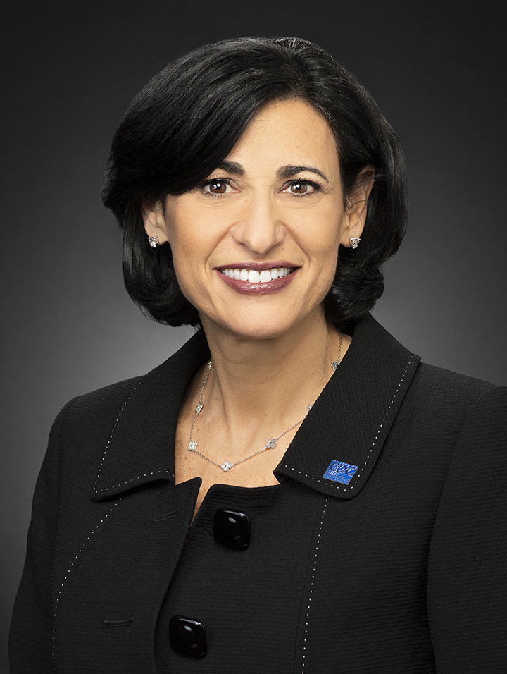 photo of Rochelle Wallensky; woman looking at camera, smiling, with black hair, brown eyes, and wearing a black jacket with a CDC blue pin on the lapel