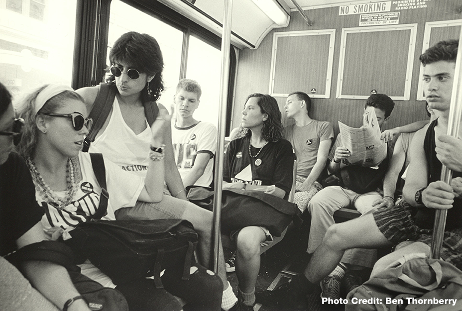 photo of young people on a bus, mostly young and many are ACT UP members going to a demonstration at Phyllis Schlafly’s birthday, Republican National Convention, New Orleans, LA, 1988