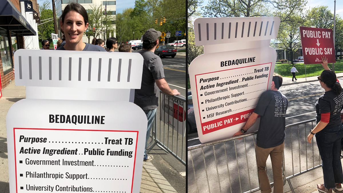 Two photos, in first a young white woman is holding a fake pill bottle that has a label with facts about bedaquiine funding; in the second one person is holding this same sign, and the other is holding a sign that reads "public pay – public say"