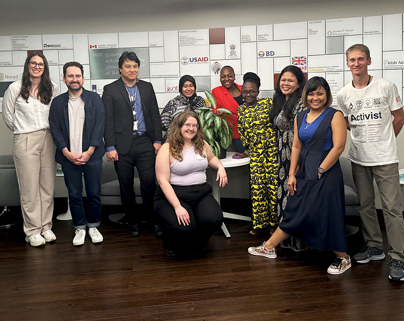 Diverse group of ten people smiling at the camera